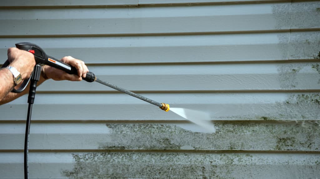 Soft-wash house washing service on residential siding in Durham Region, Ontario